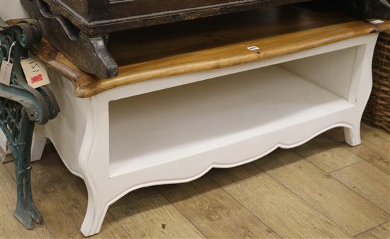 A French style painted serpentine top two tier coffee table, W.120cm